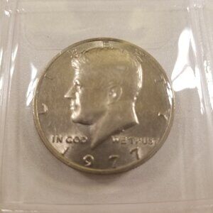 The 1977 (no-mint) Kennedy Half Dollar (One 1977 no-mint)